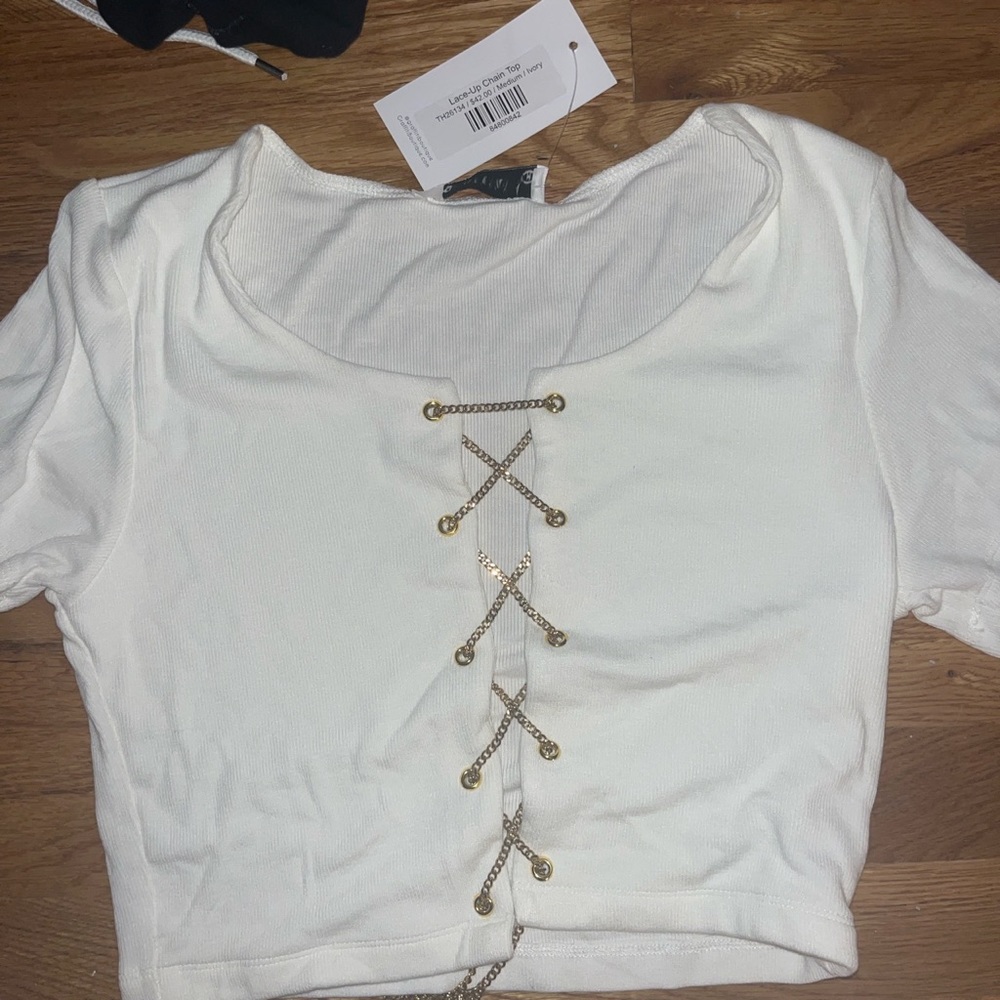 White top with gold cross overs! Very cute and stylish! And BRAND NEW NEVER WORN